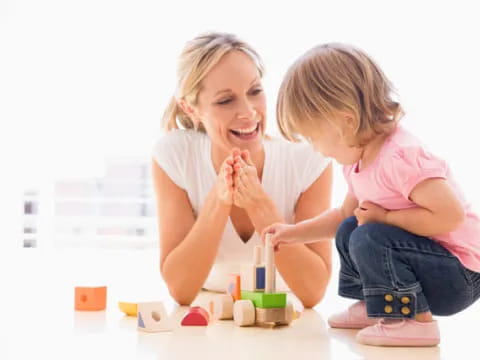 a person and a child painting