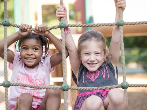 a couple of girls on swings