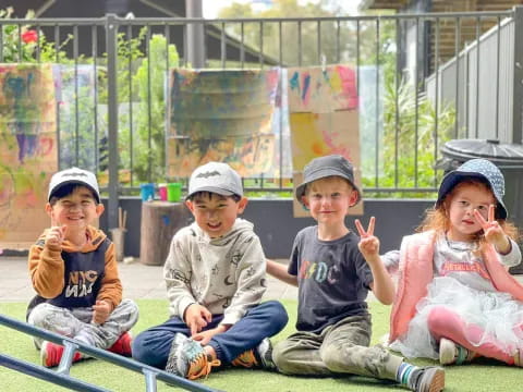 a group of kids sitting on a bench