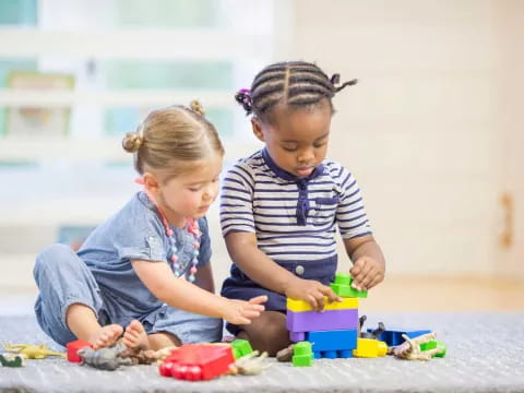 a couple of children playing with toys