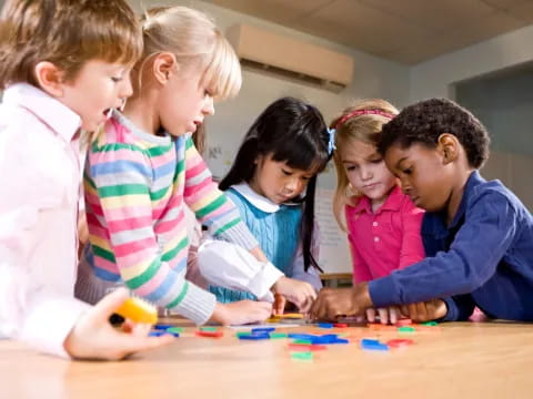 a group of children playing with building blocks