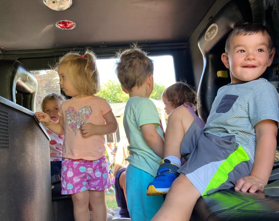 a group of children in a car