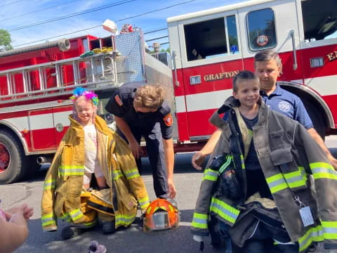 a group of people in fire suits