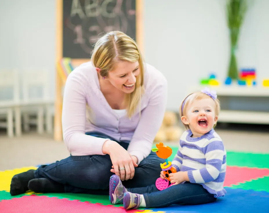 a woman and a child sitting on the floor