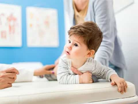 a baby crawling on a table