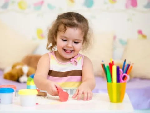 a child painting on a table