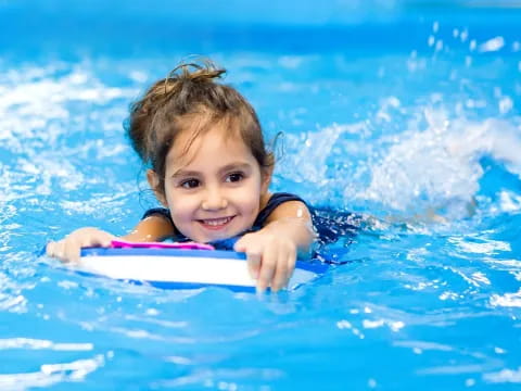 a girl swimming in the water