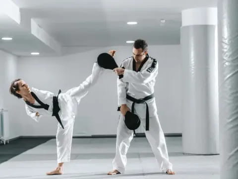 a group of people in karate uniforms