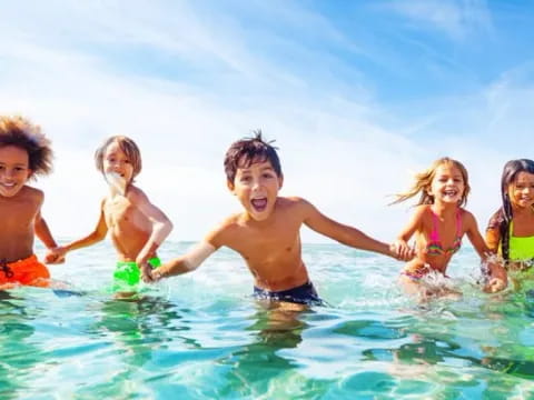 a group of children in the water