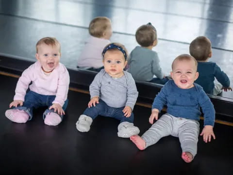 a group of children sitting on the floor