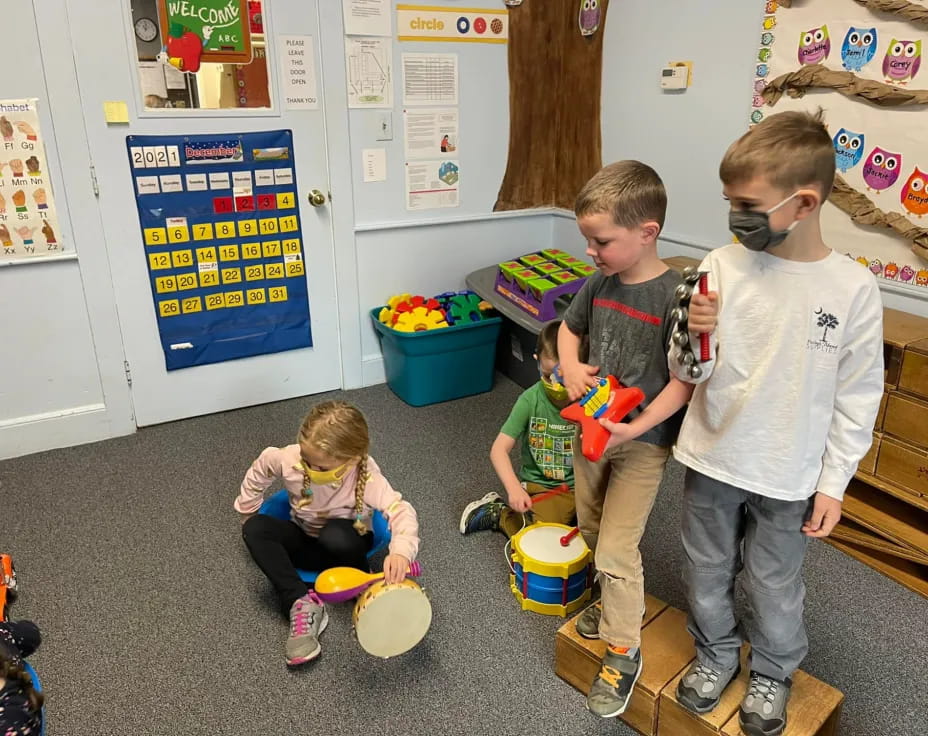 a group of children playing with toys