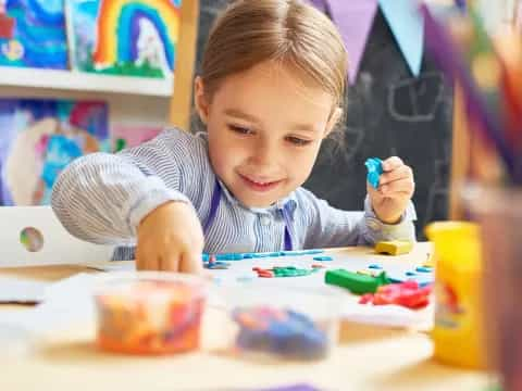 a child painting on a table