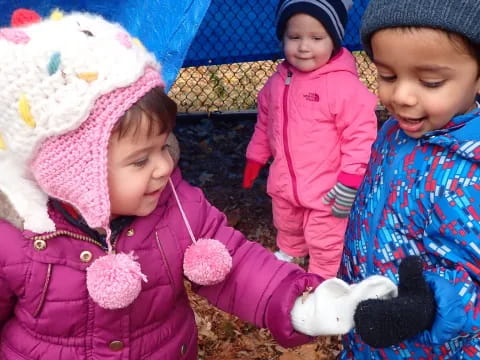 a group of children in winter clothes