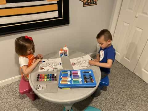 a couple of kids playing with a toy