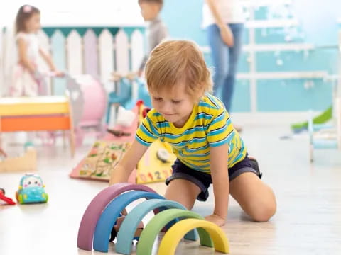 a baby playing with toys