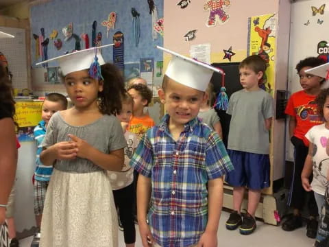 a group of children wearing paper crowns