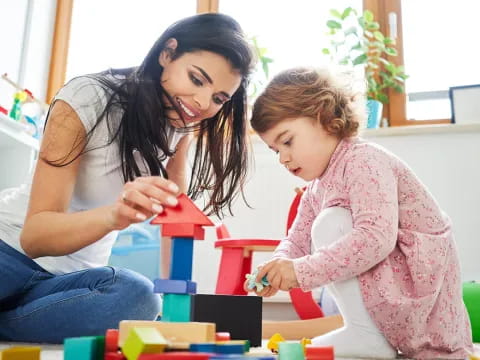 a woman and a child playing with toys