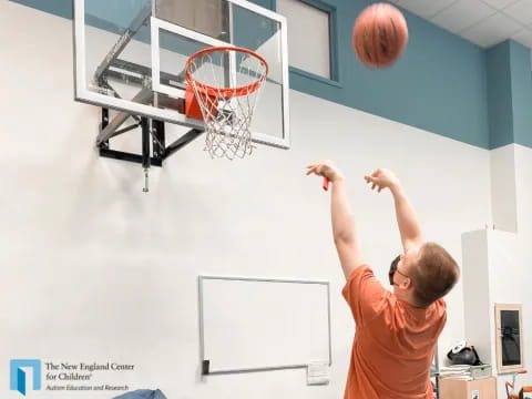 a person shooting a basketball