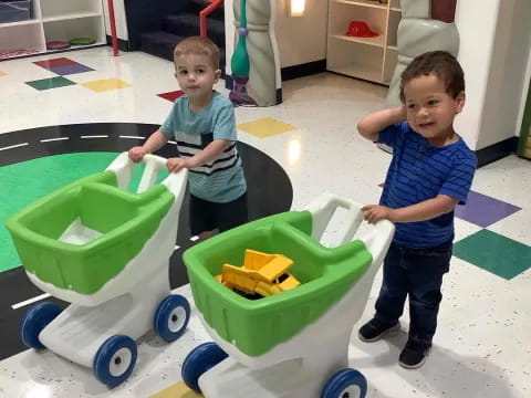 two boys playing with toys