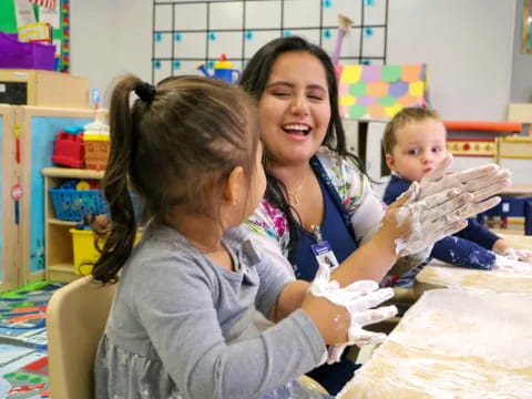 a woman and a child in a classroom