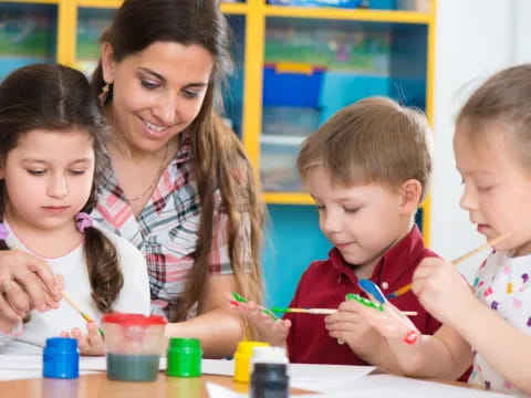 a person and children painting