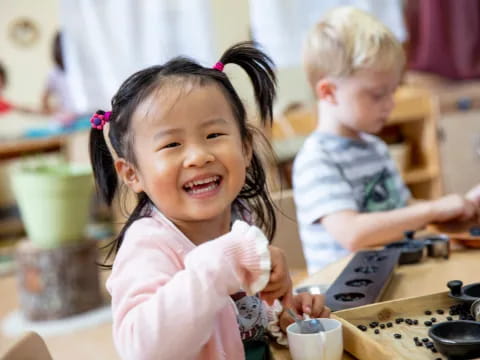 a couple of children playing with a toy