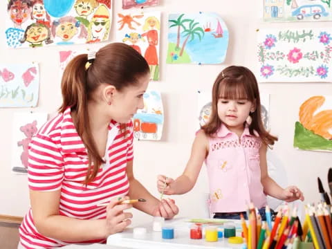 a person and a girl painting