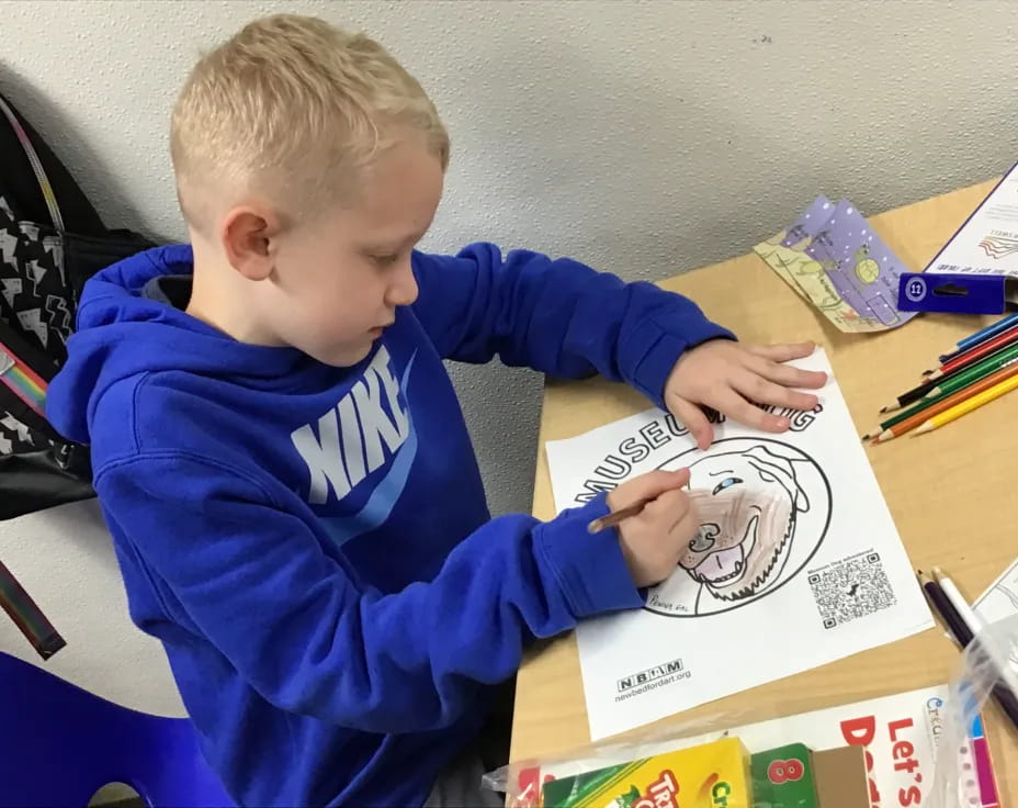 a child drawing on a paper