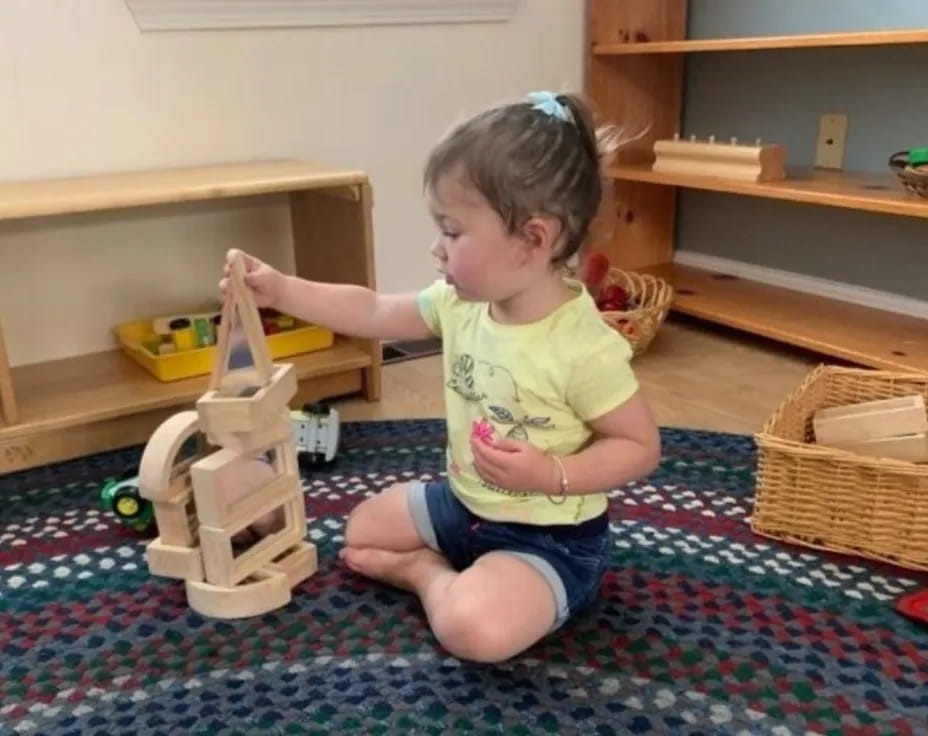 a baby playing with a toy