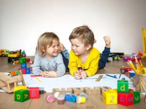 a couple of children playing with toys