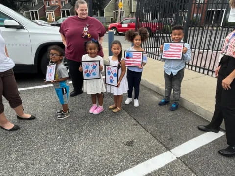 a group of people holding signs