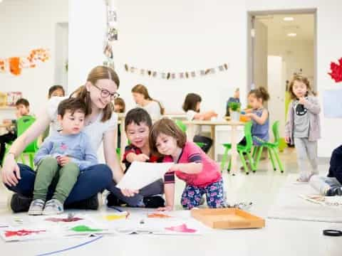 a group of children sitting on the floor