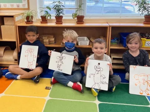 a group of children holding signs