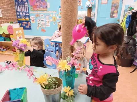 a group of children at a flower shop