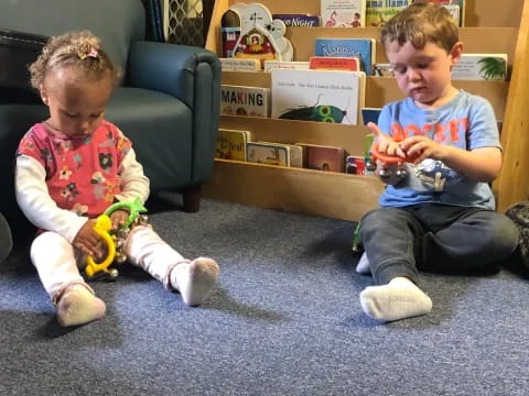 a couple of kids playing with toys
