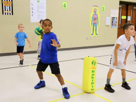 a group of kids playing basketball