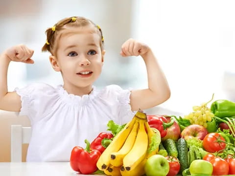 a baby with a bunch of fruits