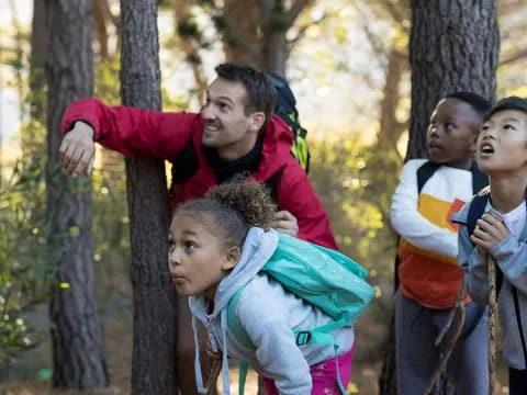 a group of people in the woods