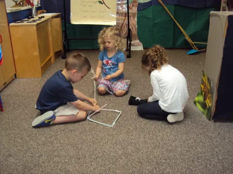 a group of children playing with a toy