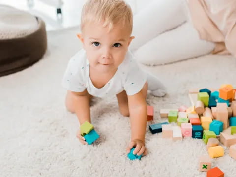 a baby playing with toys