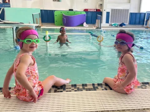 a couple of girls in a pool