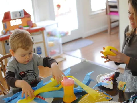 a person and a child painting