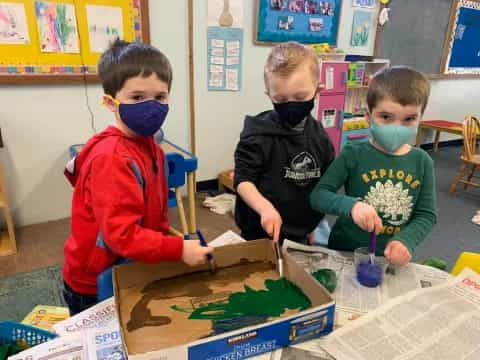 a group of children wearing masks