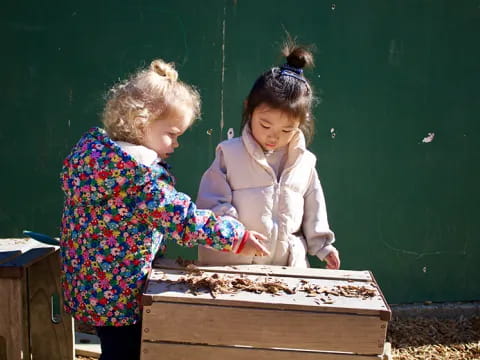 a couple of girls playing a board game