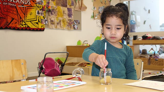 a child sitting at a table