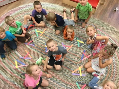 a group of children playing with toys