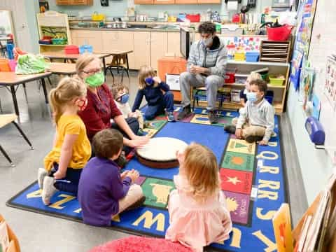 a group of children sitting on the floor