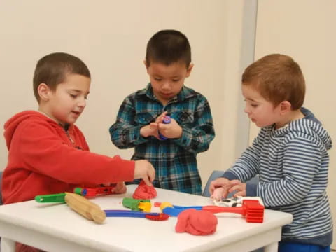 a group of boys playing with toys