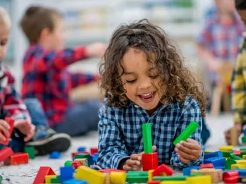 a group of children playing with toys