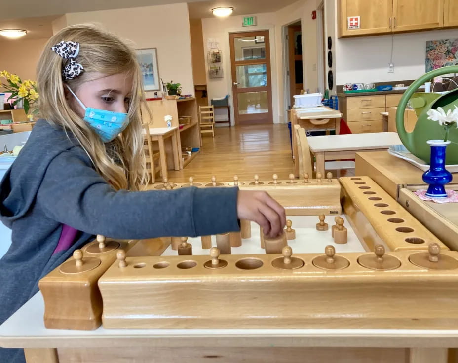 a girl with a mask on playing a game